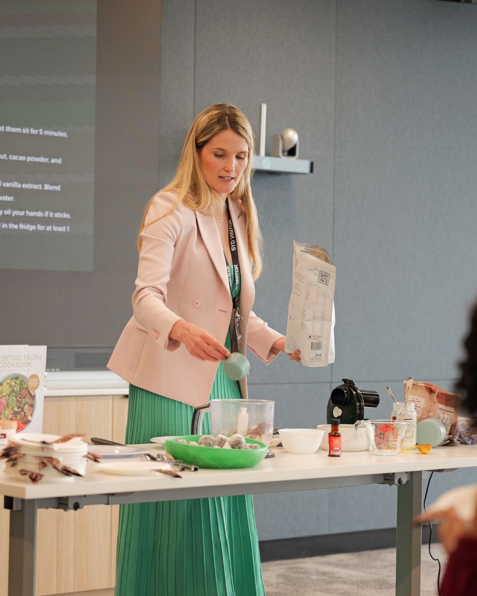 A dietitian running a hands-on nutrition session for a workplace team