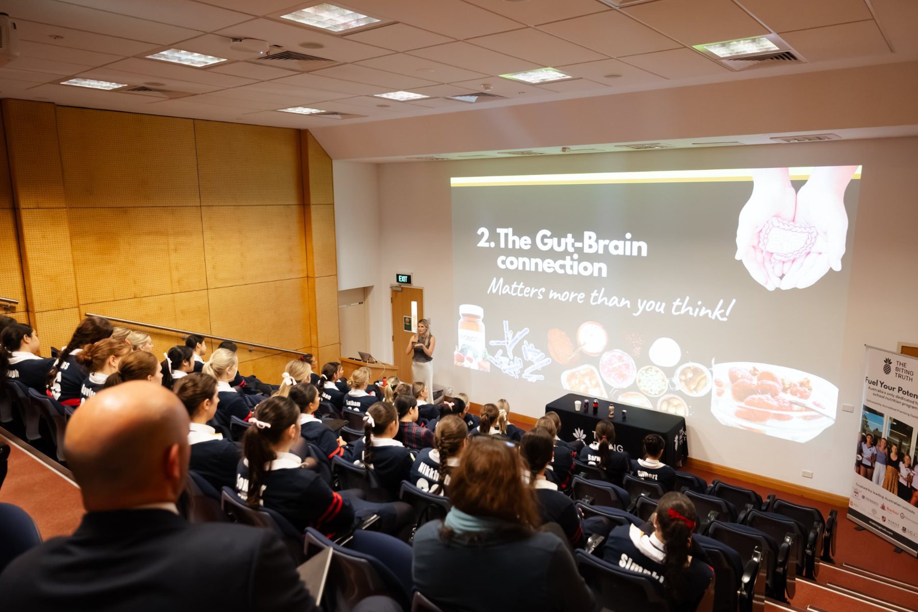 Students listening to a Fuel Your Potential nutrition session in a school lecture theatre